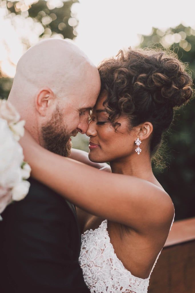 a bride and groom embracing each other