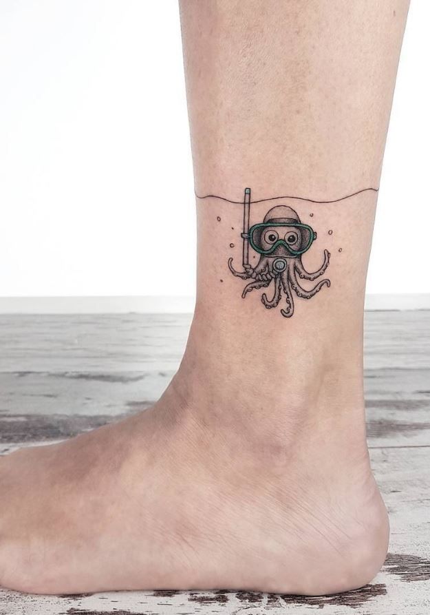 an octopus tattoo on the foot of a person