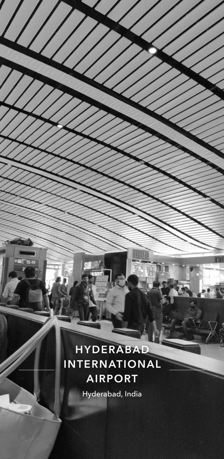 black and white photo of people at an airport terminal with text overlaying the image