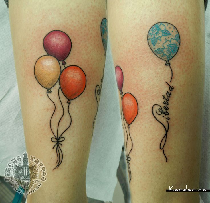 two tattoos with balloons on their legs