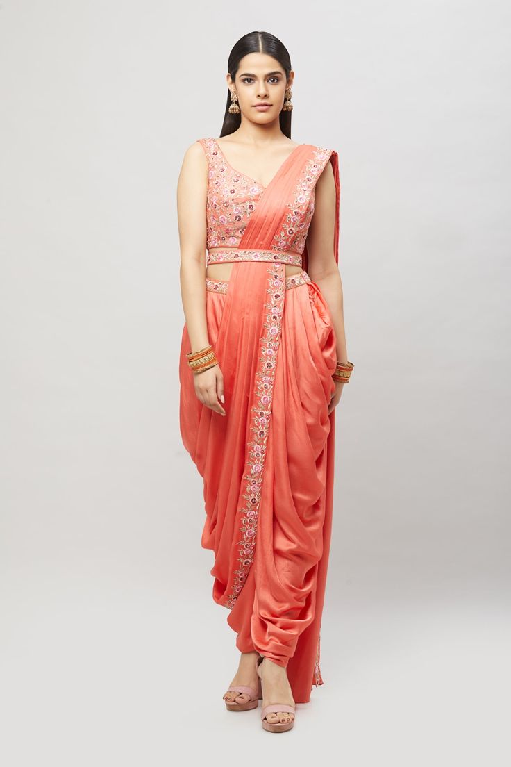 Modern, fun and chic! This readymade coral dhoti saree with multi-resham embroidery is perfect for any bridal event! Fabric: Satin silk Ready to Ship Occasion: Sangeet, Mehendi Events WASH CARE INSTRUCTIONS - Please Dry clean only when it is applicable. Slight color variation is possible due to digital photography. Jewelry not included Navratri Floor-length Dola Silk Pre-draped Saree, Wedding Pre-draped Saree With Dori Work, Embroidered Draped Lehenga For Diwali, Designer Embroidered Draped Saree, Diwali Embroidered Draped Lehenga, Bollywood Style Embroidered Draped Choli, Bollywood Embroidered Draped Choli, Festive Draped Traditional Wear With Resham Embroidery, Wedding Art Silk Draped Saree