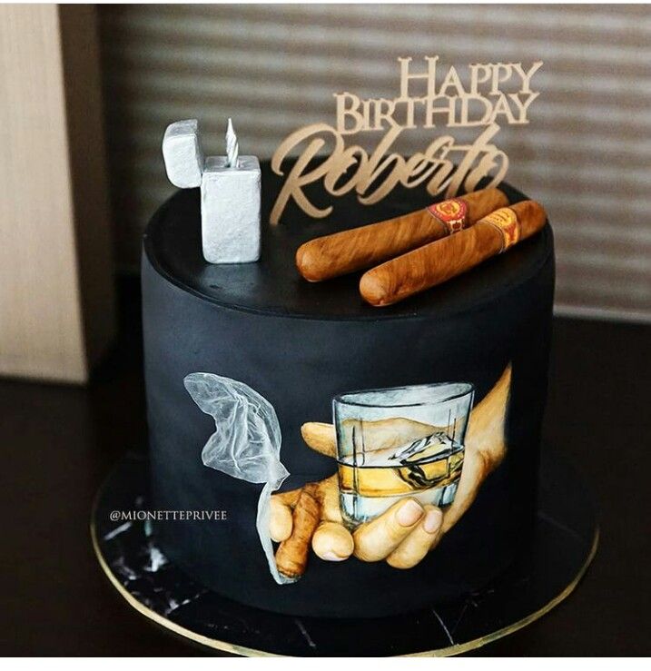 a black birthday cake with cigars and a glass on the top that says happy birthday robert