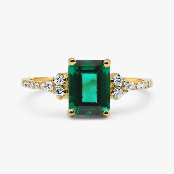 Emerald and diamond ringVintage inspired handmade Emerald and Diamond ring.This ring showcases a beautiful Green Emerald 8 x 6 mm Octagon cut surrounded by Excellently cut brilliant Diamonds.Handmade by artist in solid gold with an utmost attention to details.Beautifully finished with Each diamond and gemstone handpicked and inspected for the best color and depth.`Get this ring today and enjoy it forever!- Made to Order, perfectly finished, Fast shipping fully insured and traceable online.- Gems Green Emerald Diamond Ring With Accents, Classic Emerald Promise Ring With Birthstone, Classic Emerald Ring For Promise, Promise Emerald Ring In Yellow Gold, Timeless Emerald Ring With Accent Stones For Promise, Green Emerald Ring With Diamond Accents For Promise, Green Emerald Promise Ring With Diamond Accents, Classic Green Emerald Ring With Diamond Accents, Green Emerald-cut Cluster Ring With Diamond Accents