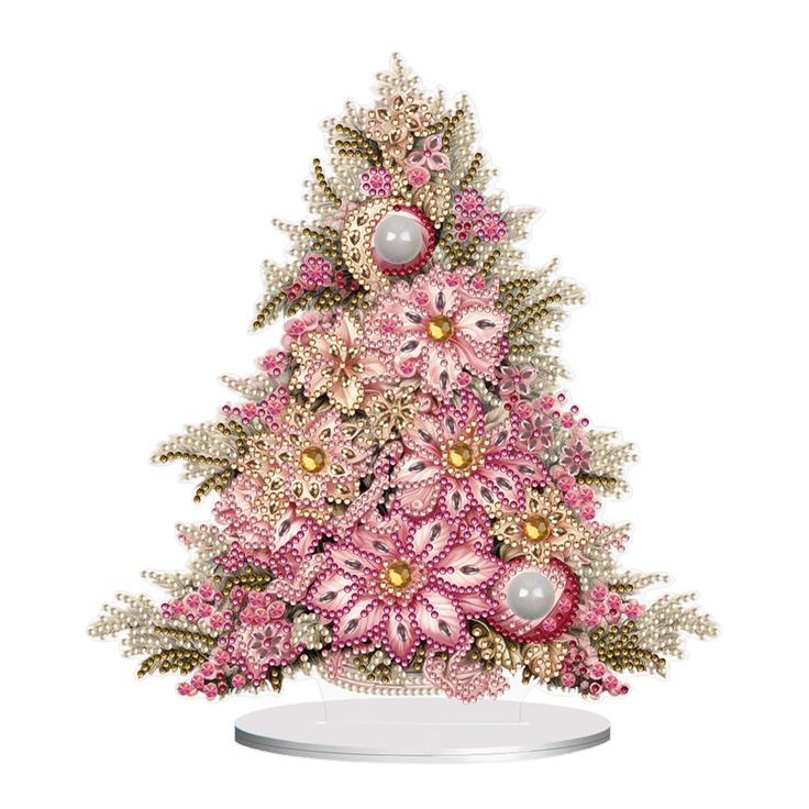 a pink and gold christmas tree with ornaments on it's top, in front of a white background