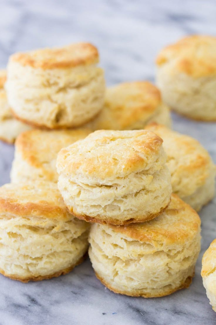 some biscuits are stacked on top of each other and ready to be eaten for breakfast