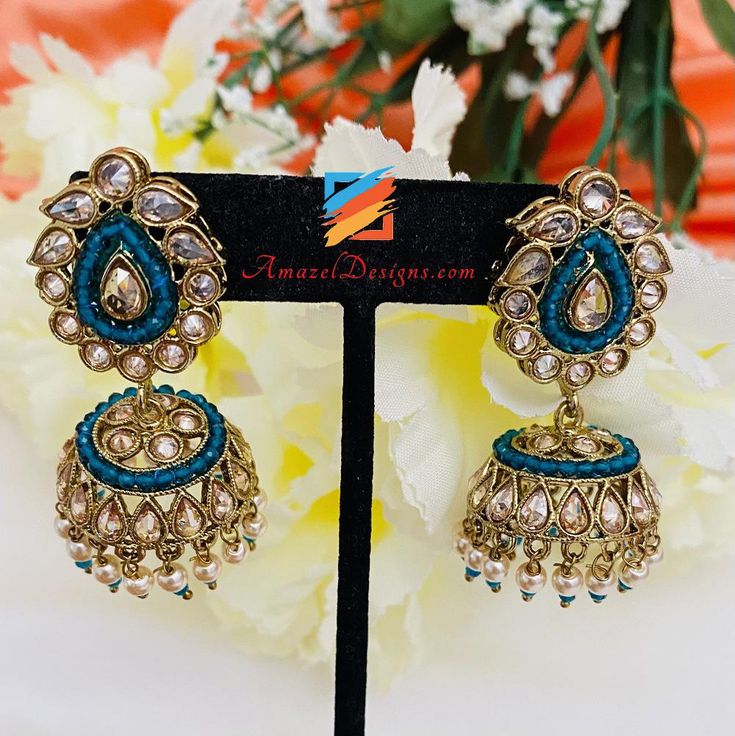 Cyan Blue Polki Small Jhumki Available to shop online and delivered to your doorsteps anywhere in the world with our Everything-Everywhere FREE Shipping. 📦 Shipped FREE from Canada to USA, Europe, Italy, France, Norway and every other country. EXPLORE more INDIAN STUD EARRING, Indian Earrings, AD Jewellery or Vaali Earrings - Can be matched with our Elegant Single Line Necklaces Natasha, Denmark ⭐️⭐️⭐️⭐️⭐️ Thank you so much kiran di. I ordered kadha set for my mom and churra for my sister. They Blue Earrings For Diwali, Blue Danglers With Latkans For Celebration, Blue Chandbali Jhumkas With Latkans, Blue Tilla Jhumkas For Festivals, Blue Jhumkas With Tilla For Festivals, Blue Chandbali Jhumkas For Diwali, Blue Jhumkas For Festive Occasions, Blue Jhumkas With Latkans For Diwali, Blue Earrings With Cutdana For Diwali