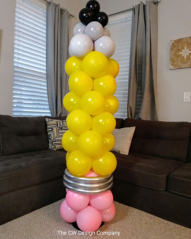 a stack of balloons sitting on top of a table