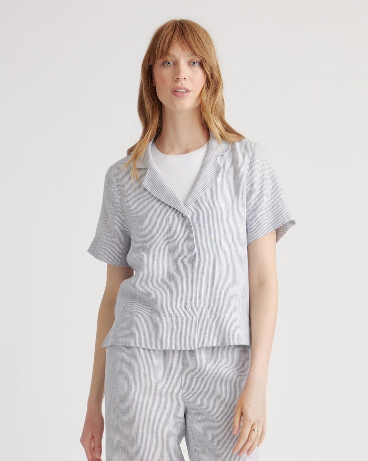 A year-round linen short-sleeve shirt? Yes, please. This button down linen shirt has a collar for an elevated look, is lightweight and made from organic materials. Its airy construction makes it perfect for basically occassion. Especially with the matching linen pants.  | Quince | Women's Short Sleeve Shirt in Blue Pinstripe, Size Small, Linen Breathable Clothes, Classic Blouses, Short Sleeve Shirt Women, Linen Short, Wide Leg Linen Pants, European Linens, Linen Pants Women, Organic Materials, Linen Shorts