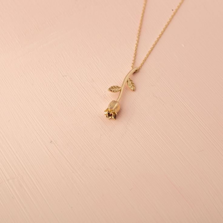 Our 14K Solid Gold Rose Necklace is a testament to timeless beauty and romantic elegance. This exquisite necklace features a rose flower pendant, elegantly crafted and sized at 4.6mm by 24.5mm. Whether you choose the classic appeal of Gold, the gentle allure of Rose Gold, or the modern touch of White Gold, each variant adds a unique charm to the necklace. The skinny cable chain, with a thickness of 0.89 mm, offers an adjustable length of 16" to 18", providing versatility and comfort for various Dainty Rose Colored Necklace For Her, Dainty Rose Necklace As Gift For Her, Feminine Rose Gold Jewelry With Rose Design, Rose Gold Necklaces With Rose Design For Anniversary, Rose Gold Necklace With Flower Pendant, Elegant Gold Necklaces With Rose Details, Elegant Gold Necklaces With Roses, Dainty Rose Gold Necklace With Rose Design, Classic Rose Gold Necklace As Gift For Her