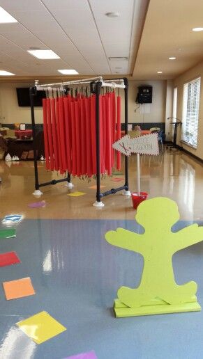 an empty room with colorful decorations on the floor