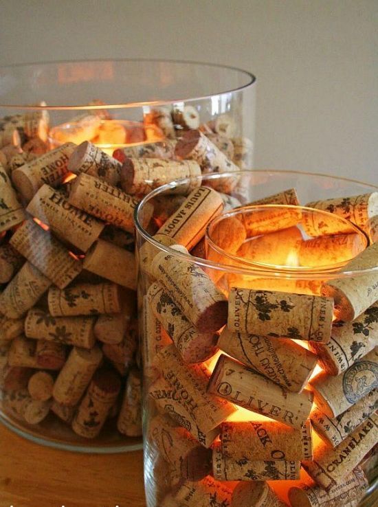 two glass bowls filled with wine corks next to each other