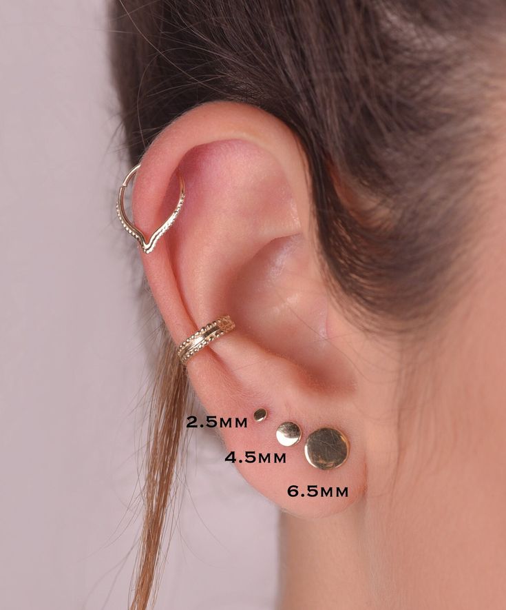 14K SOLID GOLD round SINGLE stud earring Perfect for a variety of piercing locations:  nostril / lobe / 3rd, 2nd hole earring / tragus / conch / helix / cartilage  ---> Features: ♦ Material: 14k SOLID GOLD yellow/rose ♦ Please choose the wearing surface of your stud:  1mm - (not available for 16 gauge / 1.2mm) 1.5mm  2.5 mm  3.5 mm  4.5 mm  6.5 mm  8.5 mm  ♦ Wire thickness:  Select your preference in the gauge at the top right of this page. available in 16/18/20/22 gauge = 1.2/1/0.8/0.6 mm.  Gau Dainty 14k Gold Ear Climbers For Pierced Ears, Gold Dainty Round Ear Cuff, Dainty Gold Round Ear Cuff, Classic 14k Gold Ear Climbers, Gold 14k Round Ear Cuff, 14k Gold Round Cartilage Earrings Tarnish Resistant, Dainty Yellow Gold Round Cartilage Earrings, Classic 14k Gold Ear Cuff For Pierced Ears, Tiny 14k Gold Huggie Earrings