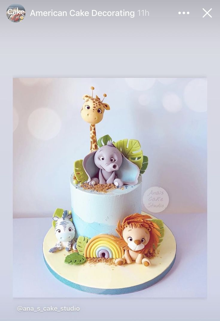 the cake is decorated with animals on it and has an instagram message above it