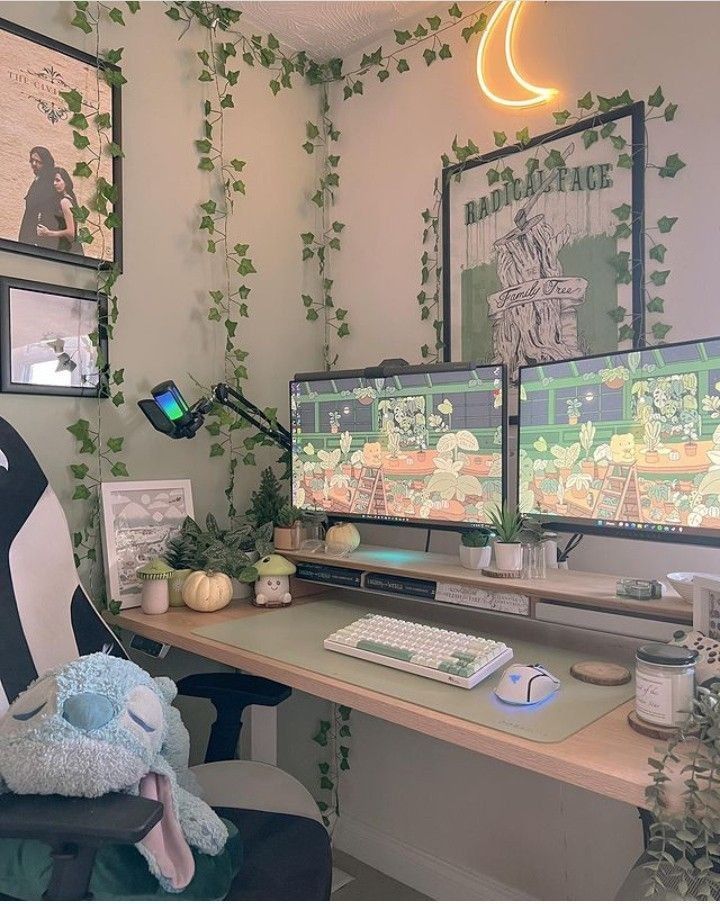 two computer monitors sitting on top of a desk next to a keyboard and monitor screen