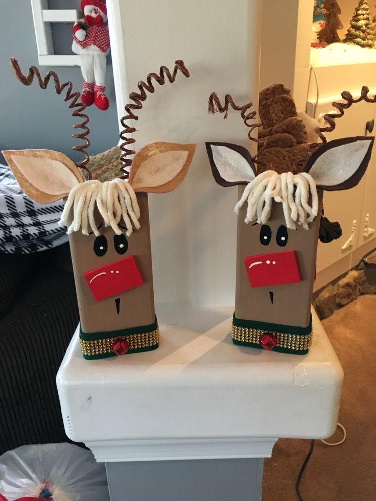 two paper bags that have been made to look like reindeers