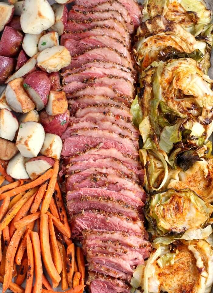 an assortment of meats and vegetables on a platter