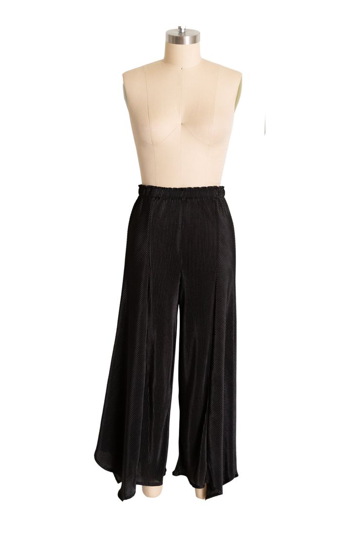 Introducing the "SLINK PANTS," a chic pair of pants with accordion-pleated fabric that adds texture and movement to your look. The pants, with their unique triangular hemline and cropped length, provide a sophisticated touch that's perfect for any occasion. The accordion pleats and variegated lines on the panels add a graceful flow and visual interest. PERFECT for all seasons and fluctuations, these pants will serve you always. Revel in the Details byVINNIK "SLINK SET" in Japanese Accordion Plea Chic Bottoms With Pleated Hem For Fall, Chic Bottoms With Folds For Spring, Chic Pants With Elastic Waistband For Evening, Chic Black Bottoms With Pleated Hem, Wide Leg Trousers With Elastic Waistband For Evening, Black Bottoms With Accordion Pleats For Fall, Chic Evening Pants With Elastic Waistband, Evening Wide Leg Trousers With Elastic Waistband, Chic Evening Bottoms With Folds