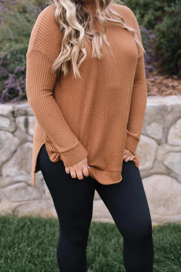 cozy up to this brushed thermal waffle knit. it has long fitted sleeves and then the rest is loose and flowy, just how we like it. split high low hem. it is so soft and long enough to throw on with your favorite pair of leggings. riley is 5'8" and wearing a 1XL. fits true to size for an oversized fit. 1XL measurements: 31.5" length, 53" bust. Cozy Waffle Knit Sweater For Loungewear, Stretch Waffle Knit Sweater For Fall, Long Sleeve Waffle Knit Stretch Sweater, Waffle Knit Long Sleeve Sweater, Stretch Waffle Knit Long Sleeve Sweater, Everyday Long Sleeve Waffle Knit Sweater, Everyday Waffle Knit Long Sleeve Sweater, Brown Long Sleeve Waffle Knit Tops, Brown Waffle Knit Long Sleeve Top