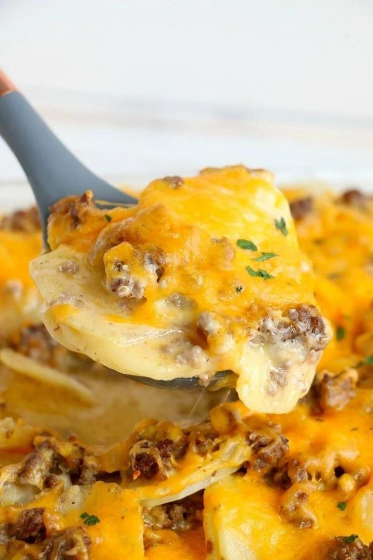 a spoon full of cheese and meat casserole