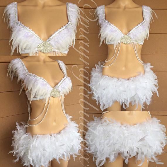 two mannequins with white feathers and beads on them, one in the shape of a bathing suit