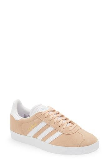 Initially designed as a training shoe for top athletes in 1991, adidas' iconic Gazelle sneaker has been refreshed with a sleek, narrower silhouette but retains the classic contrasting 3-Stripes and heel tab of the original, and is presented in throwback archival hues. Lace-up style Cushioned footbed Removable insole Leather or leather and synthetic upper/textile and synthetic or synthetic lining/synthetic sole Imported BP. Shoes Leather Sneakers For Skateboarding In Spring, Spring Adidas Sneakers, Spring Low-top Skate Shoes With Boost Midsole, Adidas Mid-top Sneakers For Spring, Adidas Sneakers With Gum Sole, Spring Sports Skate Shoes With Gum Sole, Spring Sneakers For Skateboarding, Skate Shoes With Gum Sole For Spring Sports, Spring Skateboarding Sneakers With Laces