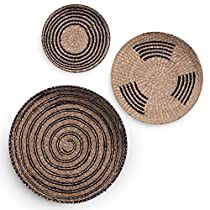 three black and brown baskets sitting next to each other on top of a white surface