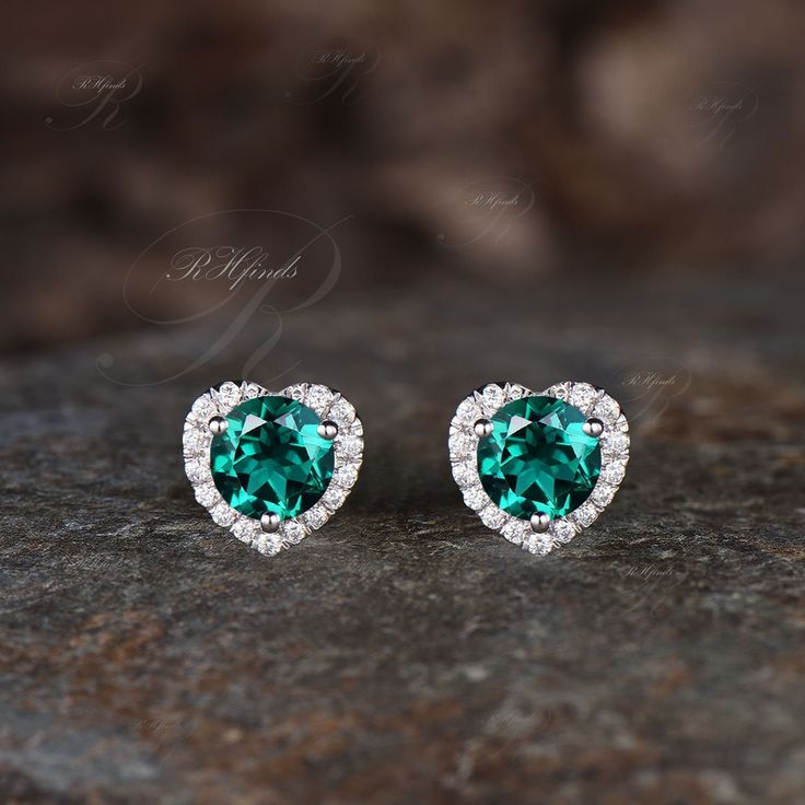 Product Detail Material: 925 Sterling Silver, 10k/14k/18k Solid Rose/White/Yellow Gold, Platinum Quantity: 2pcs (a pair) earrings Center Stones: 6mm Round Cut Lab Emerald Side Stones: Round Cut Moissanites Custom Service 1, Gemstones can be replaced with others. 2, All metal can be customized. 3, The earrings can be customized according to the design you want. Please contact us if you need any personalized custom earrings. We will try our best to meet your needs. Only you can't think of it, we c Formal Green Heart-shaped Earrings, Heart Cut Prong Setting Fine Jewelry Earrings, Elegant Green Heart Cut Earrings, White Gold Heart Shaped Gemstone Earrings, Heart-shaped White Gold Gemstone Earrings, White Gold Heart Gemstone Earrings, White Gold Heart Earrings With Gemstones, Wedding Heart Cut Gemstone Earrings, Heart Cut Gemstone Earrings For Wedding