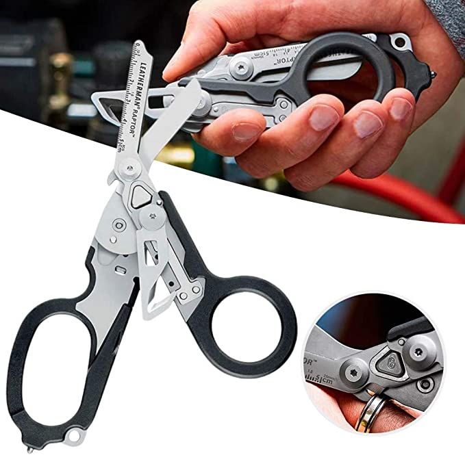 a person holding a pair of scissors in their left hand and the other hand is open