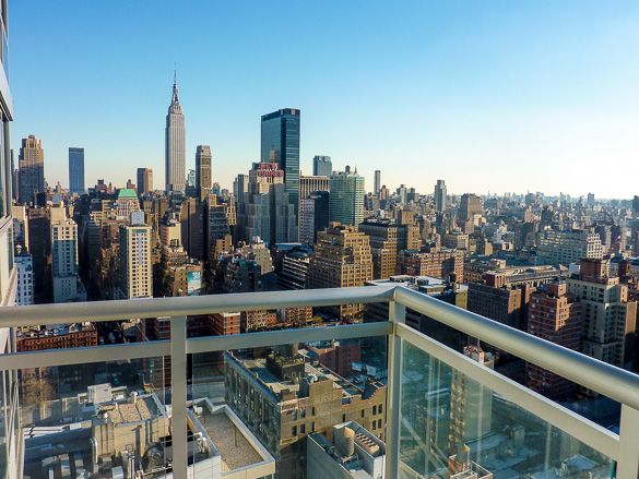 a balcony overlooking a city skyline with skyscrapers