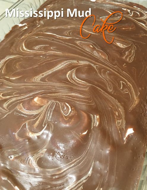 a close up of a cake with chocolate frosting on it and the words mississpii mud cafe