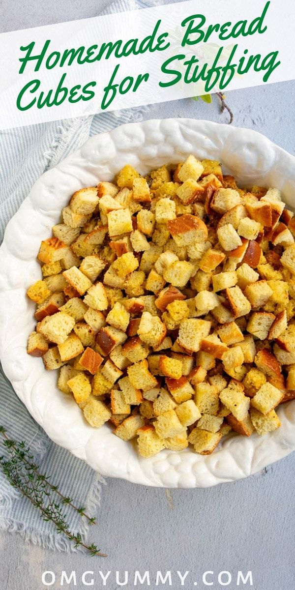 homemade bread cubes for stuffing in a white bowl on a table with text overlay