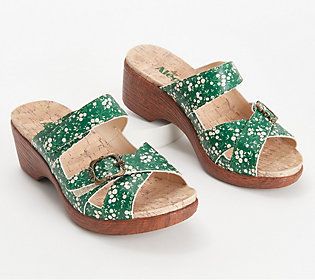 Jump into summer with a stylized statement. These leather heeled sandals elevate your fashion levels all the way up to feisty, and we are loving it. From Alegria. Summer Wedge Heels With Wooden Heel, Summer Heels With Wooden Wedge Heel, Casual Spring Mules With Buckle Closure, Summer Cushioned Low Heel Sandals, Green Clogs For Spring Beach Occasions, Green Clogs For Beach In Spring, Summer Sandals With Cushioned Footbed And Low Heel, Summer Synthetic Clogs With Round Toe, Green Clogs With Cushioned Footbed For Summer