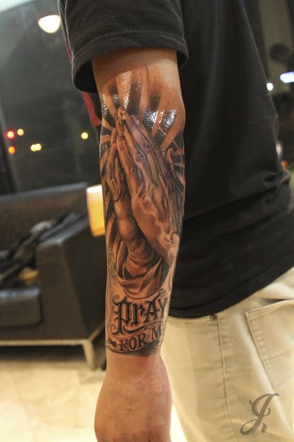 a man with a tattoo on his arm