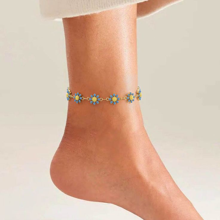 Make a statement with the Flowers Anklet, a fusion of feminine charm and modern style. Crafted with precision and attention to detail, this anklet features a stunning arrangement of floral motifs that exude elegance and sophistication, making it the perfect finishing touch for any outfit. Now available in pink, white and sky blue. Chic Summer Jewelry With Flower Charm, Spring Chic Jewelry With Flower Decoration, Chic Spring Jewelry With Flower Decoration, Blue Bohemian Anklets For Party, Elegant Blue Bracelets For Spring, Spring Party Blue Bracelets, Flower Shaped Anklets For Spring Gift, Trendy Summer Jewelry With Flower Decoration, Bohemian Flower Anklets For Summer