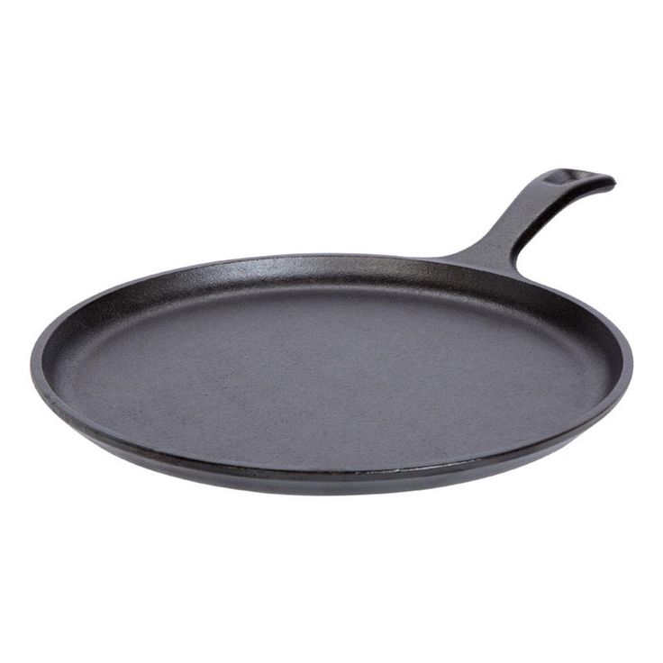 an empty cast iron skillet on a white background