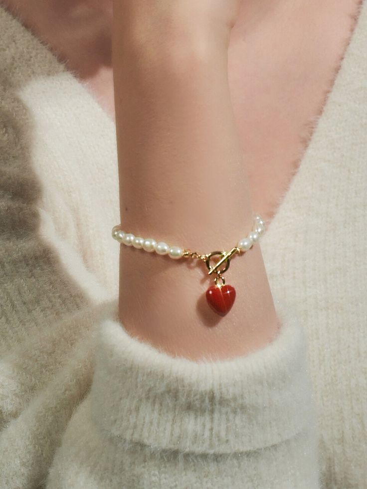 Editor's NotesENGBROX's jewelry is gorgeous and perfect for everyday wear.- Light-weighted- Eye-catching heart pendant detail- Pearl chain band- T-bar closure- Perfect for layering- Minimal and feminine stylesMeasurements(in.)- Size: 5.91in. (L)- Heart: 0.47in.- Toggle: 0.35in. outer diameter- Weight: 0.39oz.Composition & Care- Brass  Epoxy  Freshwater Pearl- Avoid direct heat and moisture- Professional cleaning is recommendedDesigner- by ENGBROX Heart-shaped Jewelry With Clasp For Gifts, Trendy Heart-shaped Jewelry With Pearl Charm, Heart-shaped Jewelry Gift With Clasp, Valentine's Day Metal Jewelry With Pearl Charm, Metal Jewelry With Heart Beads, Adjustable Pearl Bracelet With Heart Beads, Adjustable Heart Beads Pearl Bracelet, Heart-shaped Pearl Bracelet For Gift, Metal Heart Beads Jewelry