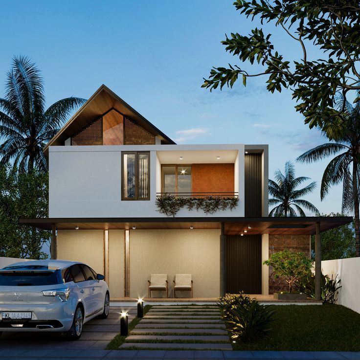 two cars parked in front of a house with palm trees and bushes on the side