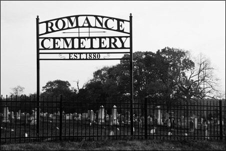 an old cemetery with a sign that says romance cemetery on it's front gate