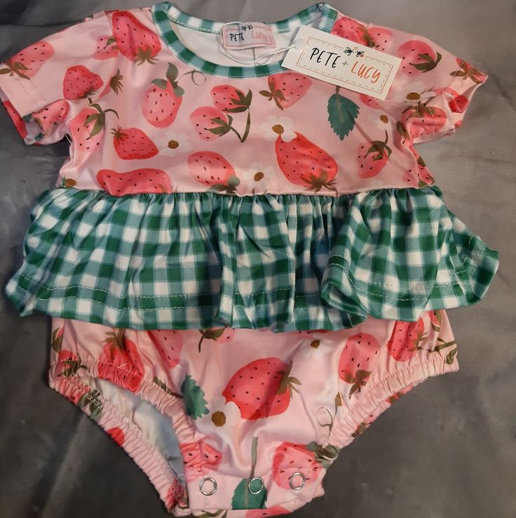 This Strawberry Picnic Romper Is By Pete+Lucy! Made Of Super Soft Milk-Soft (95% Polyester/ 5% Spandex) Fabric And Features The Cutest Happy Strawberry Print With Green And White Checker Print Ruffle! Strawberry Picnic, Toddler Costumes Girl, Shell Suit, Vintage Toddler, Nike Long Sleeve, Checker Print, Boy Onesie, Baby Boy Romper, Baby Boy Onesies