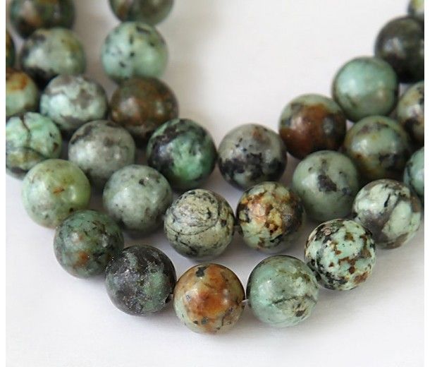 two strands of green and brown marble beads