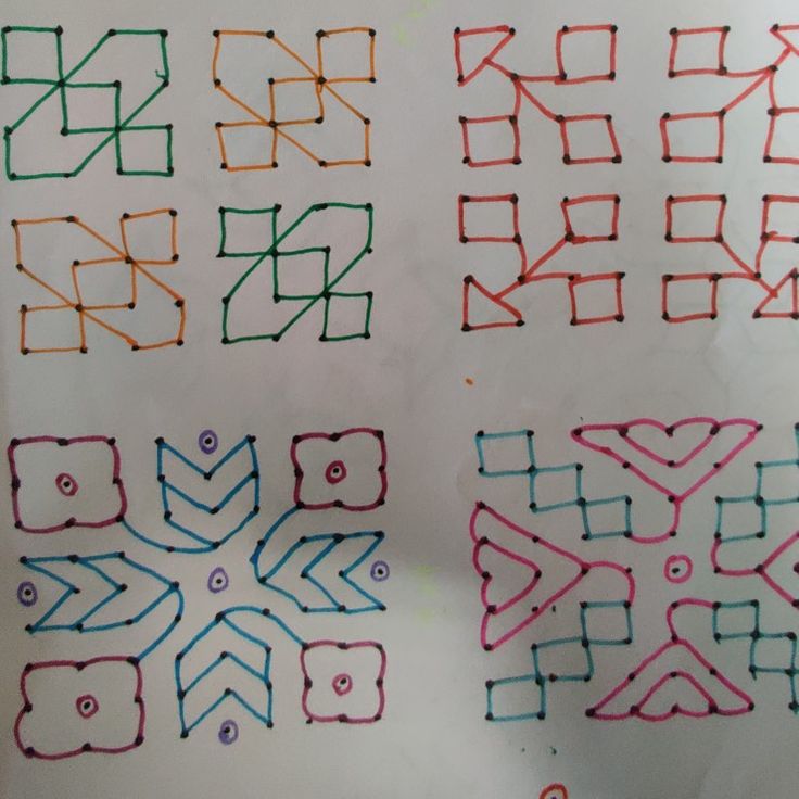 four different colored drawings on a piece of paper that has been drawn with crayons