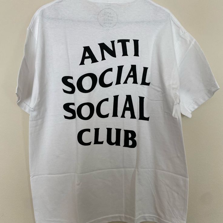 Anti Social Social Club Logo Tee Ss20 New In Bag With Tags. Never Been Worn! This Has A Small Hole On The Bottom Back. This Is A Great Spring And Summer Outfit! Fast Shipping! Product Detail Brand: Anti Social Social Club Model: Tee Color: White If You Have Any Questions Please Don't Hesitate To Message Me. Casual Cotton Shirt With Back Print, Trendy Summer Tops With Logo, Tan Cotton Shirt With Logo Print, Urban Short Sleeve Top With Logo, Summer Cotton Shirt With Logo Print, Casual Summer Tops With Logo, Casual Summer Shirt With Back Print, Casual Short Sleeve Shirt With Logo, Summer Cotton Shirt With Back Print