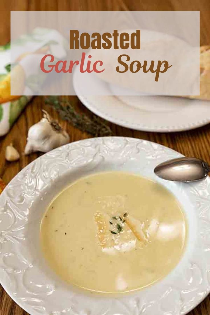 roasted garlic soup in a white bowl on a wooden table