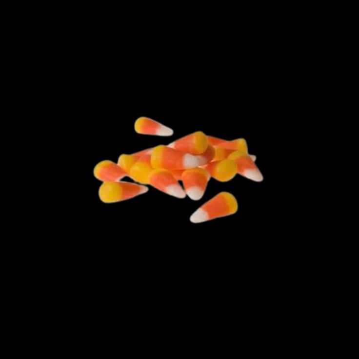 candy corn on a black background