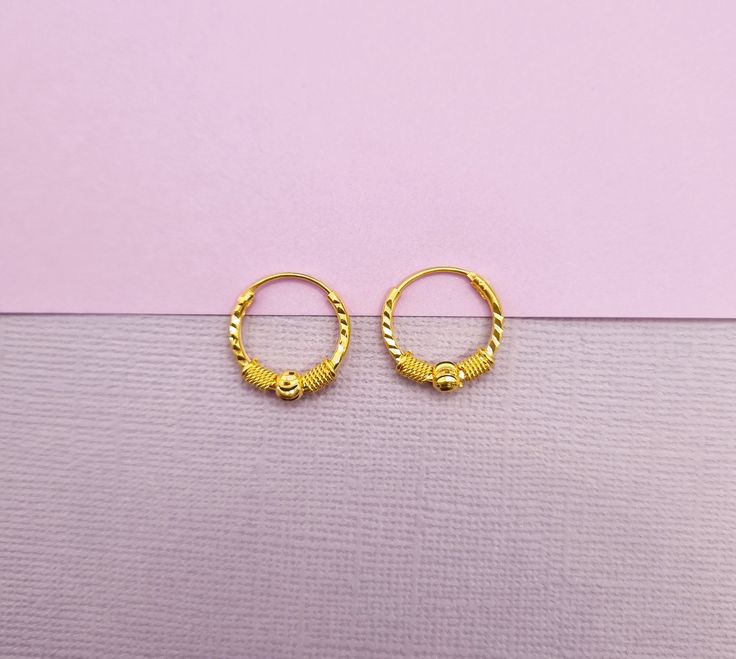 22k solid gold hoop earrings-UK 916 hallmark The hoop is approximately 15mm and 18mm in diameter. 15mm hoops - 15.7mm outside diameter and 13mm inside diameter. Our 22k jewelleries are genuine real gold. This is a special gift for baby, child, girlfriend, wife, daughter, mum, family or friend. It is a perfect gift for Christmas, New year, Valentines day, christening, birthday, wedding, anniversary and any special occasion.. Each item is packaged in our branded packaging, so your order is ready to be gifted.  All items are ready to be shipped within 2 working days through tracked post unless otherwise stated. For UK customers your order shall arrive within a week (most cases in 3 days) For customers outside the UK, your orders are ready to be shipped within 2 working days through tracked po Traditional Hoop Huggie Earrings Gift, Traditional Small Hoop Huggie Earrings For Gifts, Traditional Small Huggie Earrings As A Gift, Gold Small Hoop Nose Rings For Anniversary, Gift 22k Gold Small Hoop Earrings, 22k Gold Small Hoop Earrings As Gift, 22k Gold Small Hoop Earrings For Gifts, Yellow Gold Huggie Nose Ring Gift, Traditional Yellow Gold Huggie Earrings For Gift