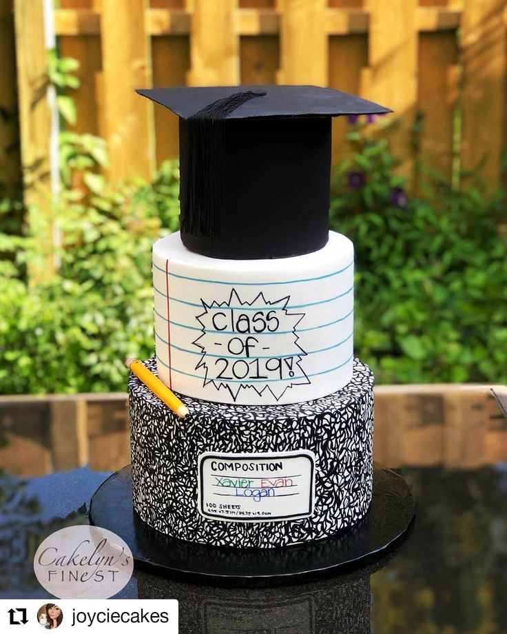 a graduation cake with writing on it