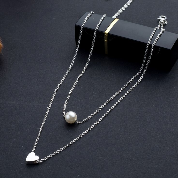 FREE SHIPPING Bohemia Simple fashion Imitation pearl love Heart Double layer Clavicle chain necklace accessories female Jewelry New JKP2835 Trendy Pearl Chain Necklace For Valentine's Day, Trendy Heart-shaped Layered Clavicle Chain Necklace, Elegant Heart-shaped Layered Necklace With Delicate Chain, Valentine's Day Metal Necklace With Pearl Chain, Dainty Heart Necklace With Pearl Chain, Valentine's Day Pearl Clavicle Chain Necklace, Elegant Alloy Heart Necklace With Clavicle Chain, Trendy Pearl Chain Jewelry For Valentine's Day, Silver Pearl Layered Necklace With Clavicle Chain