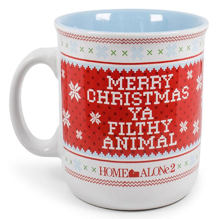 a coffee mug with the words merry christmas ya filthy animal on it's side