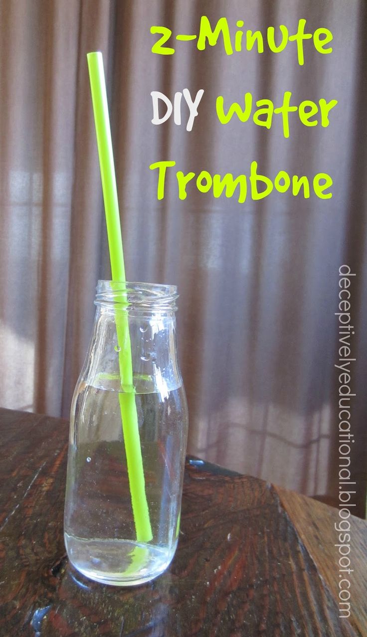 a glass with a straw in it sitting on a table