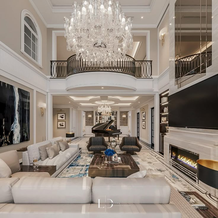 a living room filled with lots of furniture and a chandelier hanging from the ceiling